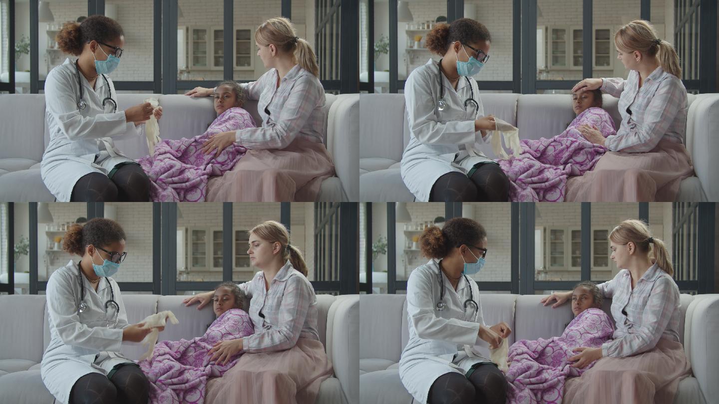 儿科医生在患者家中为女孩做检查