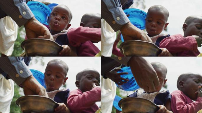 非洲儿童一起吃饭难民黑人外国人
