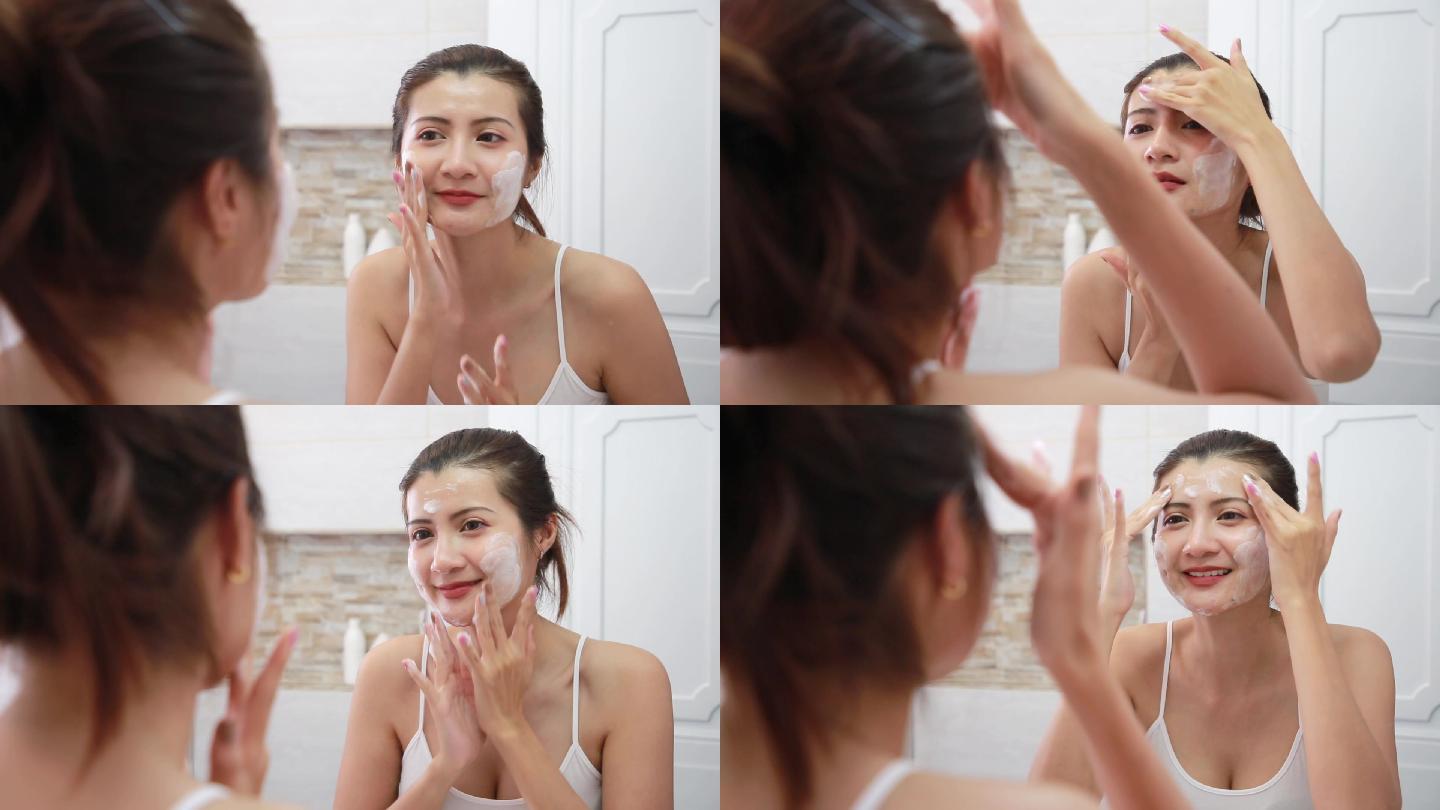 女人在浴室用肥皂清洁皮肤。