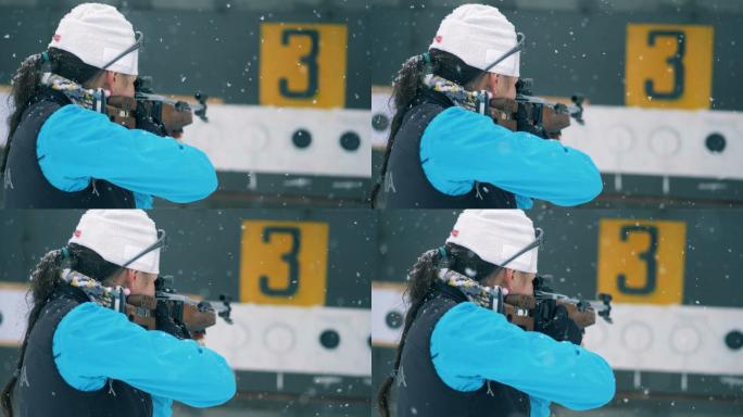 女运动员正在射击竞技冬雪冬季