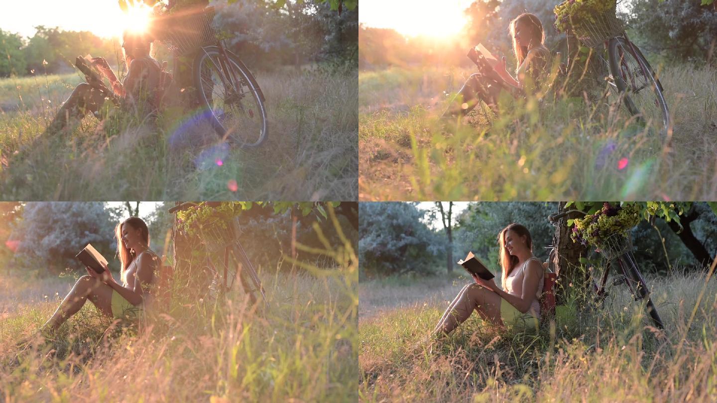 日落时，年轻美丽的女性在公园看书的肖像