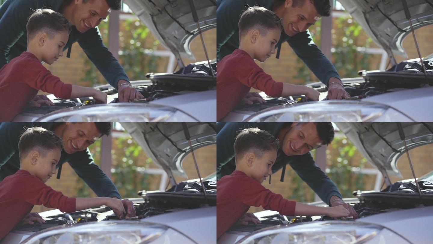 父亲和儿子正在修理汽车。