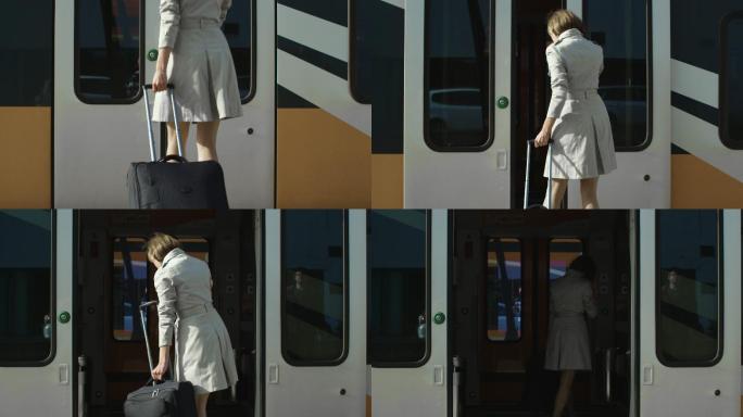 女人上地铁乘客乘车拖行李箱白领出差