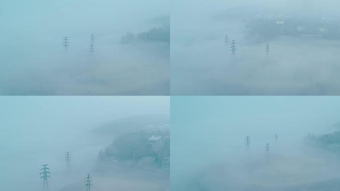 云雾里的电线塔