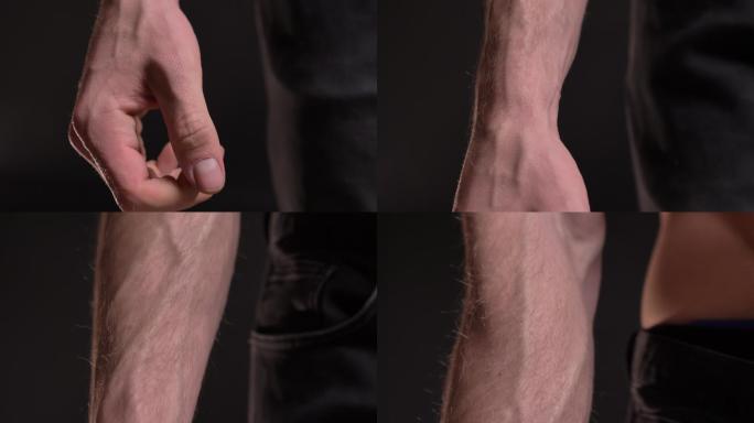 男性肌肉发达的手和拳头。