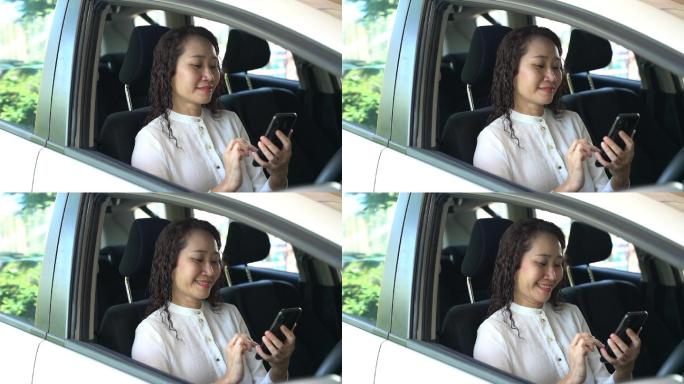 女人在车内用手机发短信