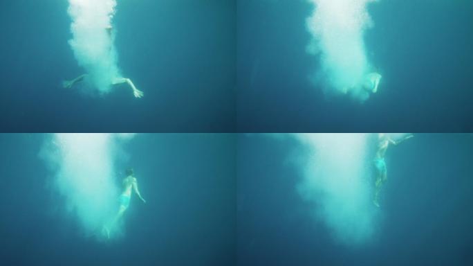 跳入水里的人潜水潜泳水下世界