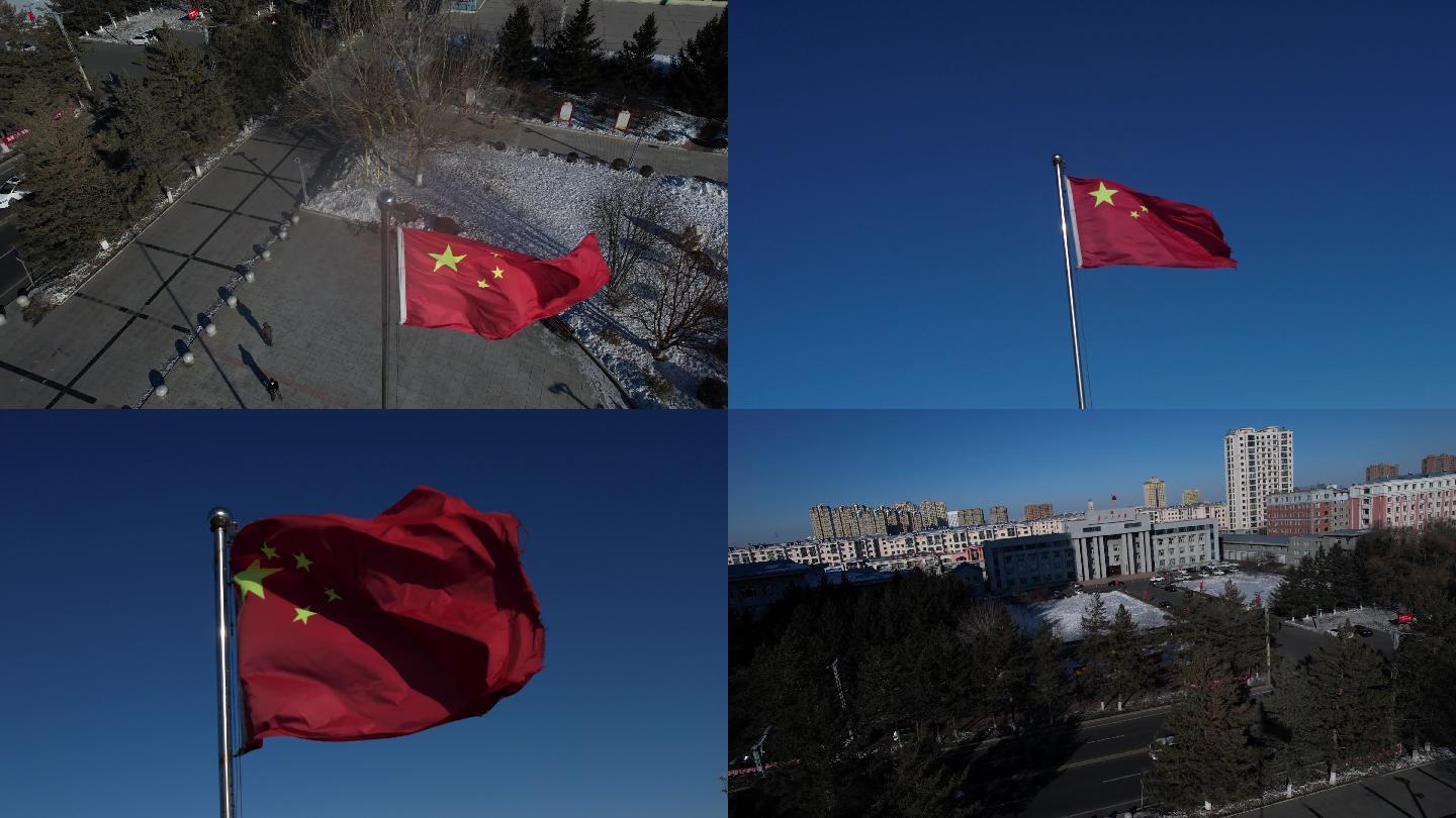 蓝天下广场上空飘扬的五星红旗和县政府大楼