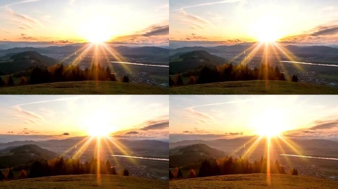 美丽的日出在阿尔卑斯山上的小城上空
