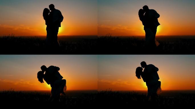 夕阳下拥吻的夫妇国外夫妻外国恋人美国爱情