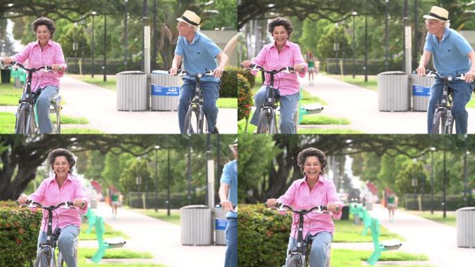 老年夫妇在公园里骑自行车