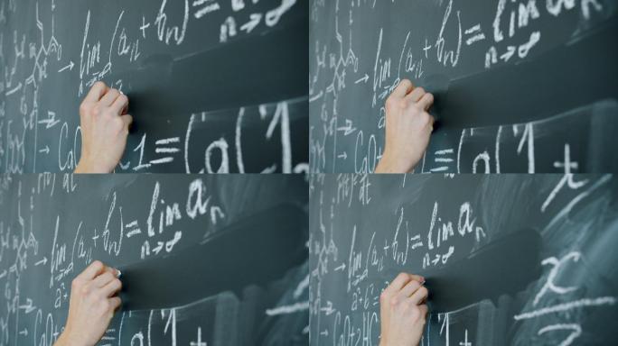 男生在课堂黑板上手写数学方程式的特写镜头
