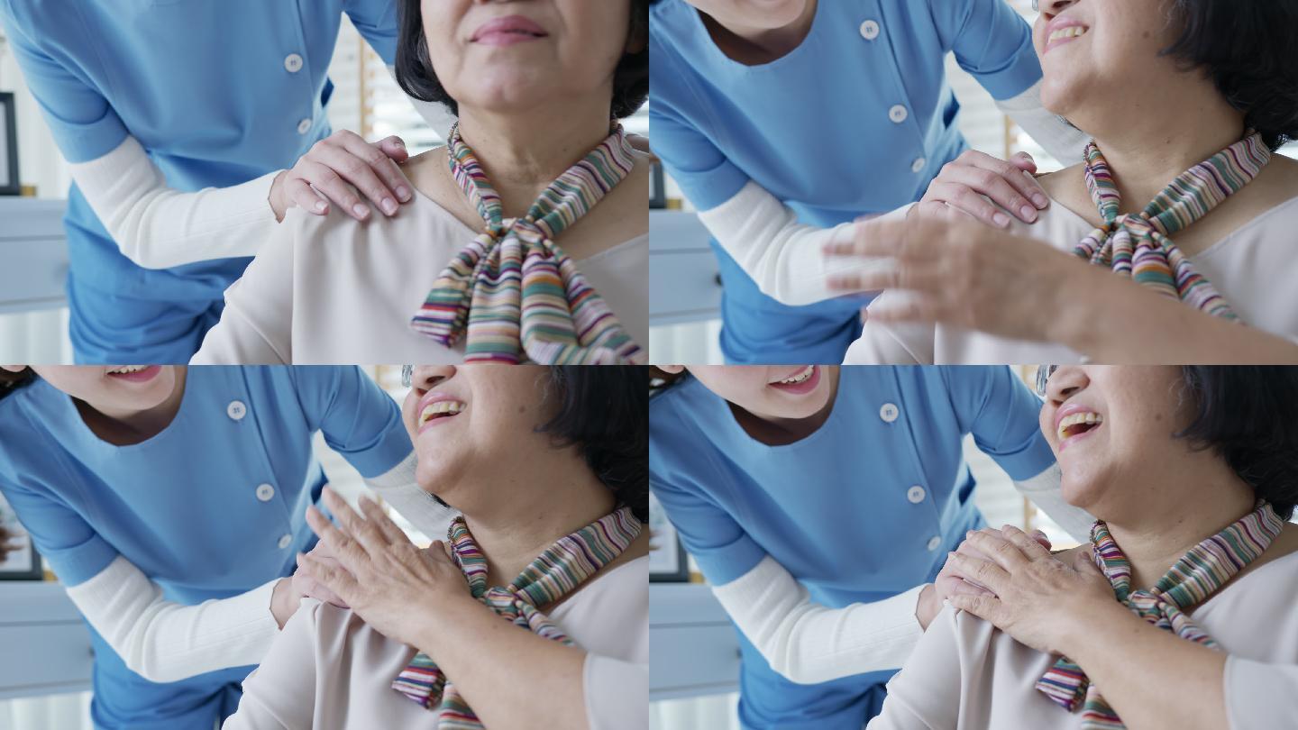 护士将手放在老奶奶的肩上