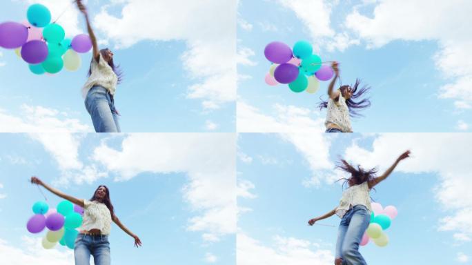 女孩在草地上跳跃。