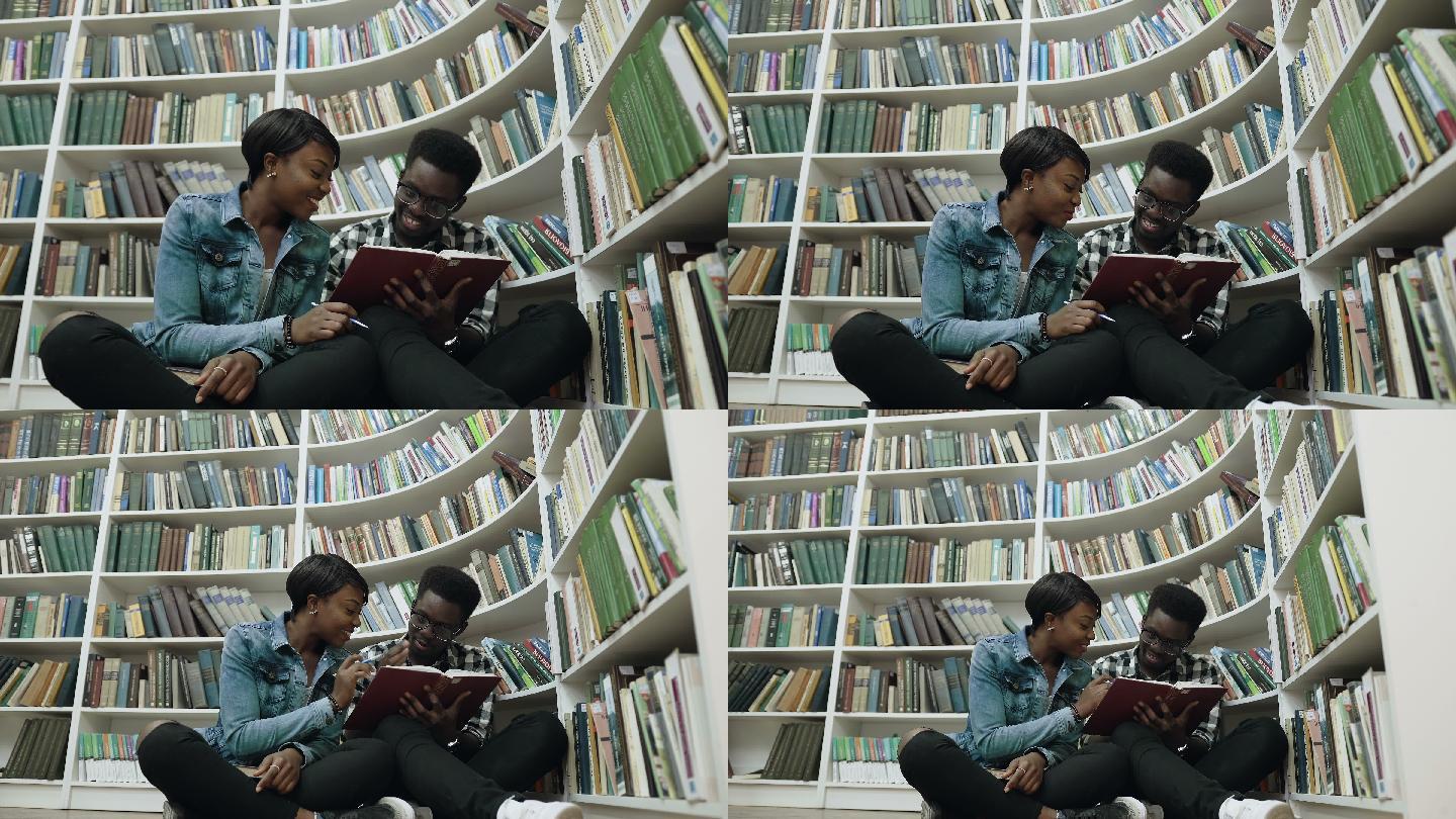 男女学生在现代大学图书馆看书