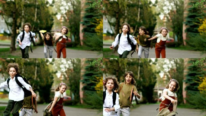 孩子们挥舞着背包从学校跑出来。