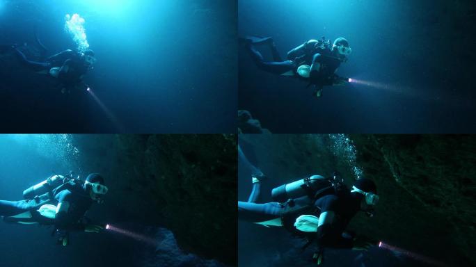 潜水员在海底洞穴中游泳
