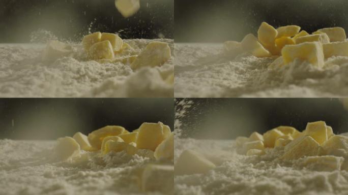 黄油 黄油块 黄油掉到面粉堆里 慢镜头