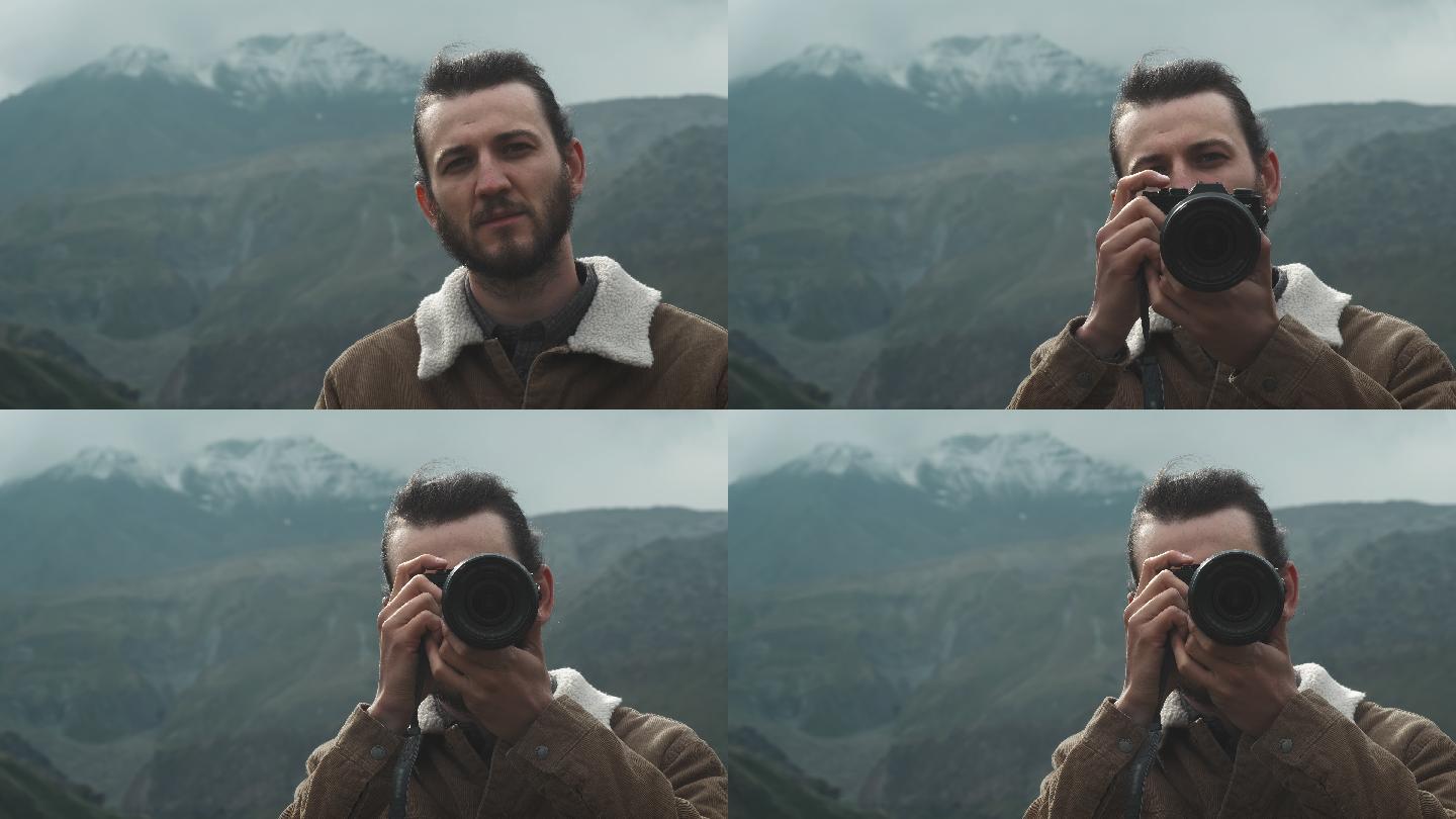 男性摄影师为博客拍摄专业的山脉图片