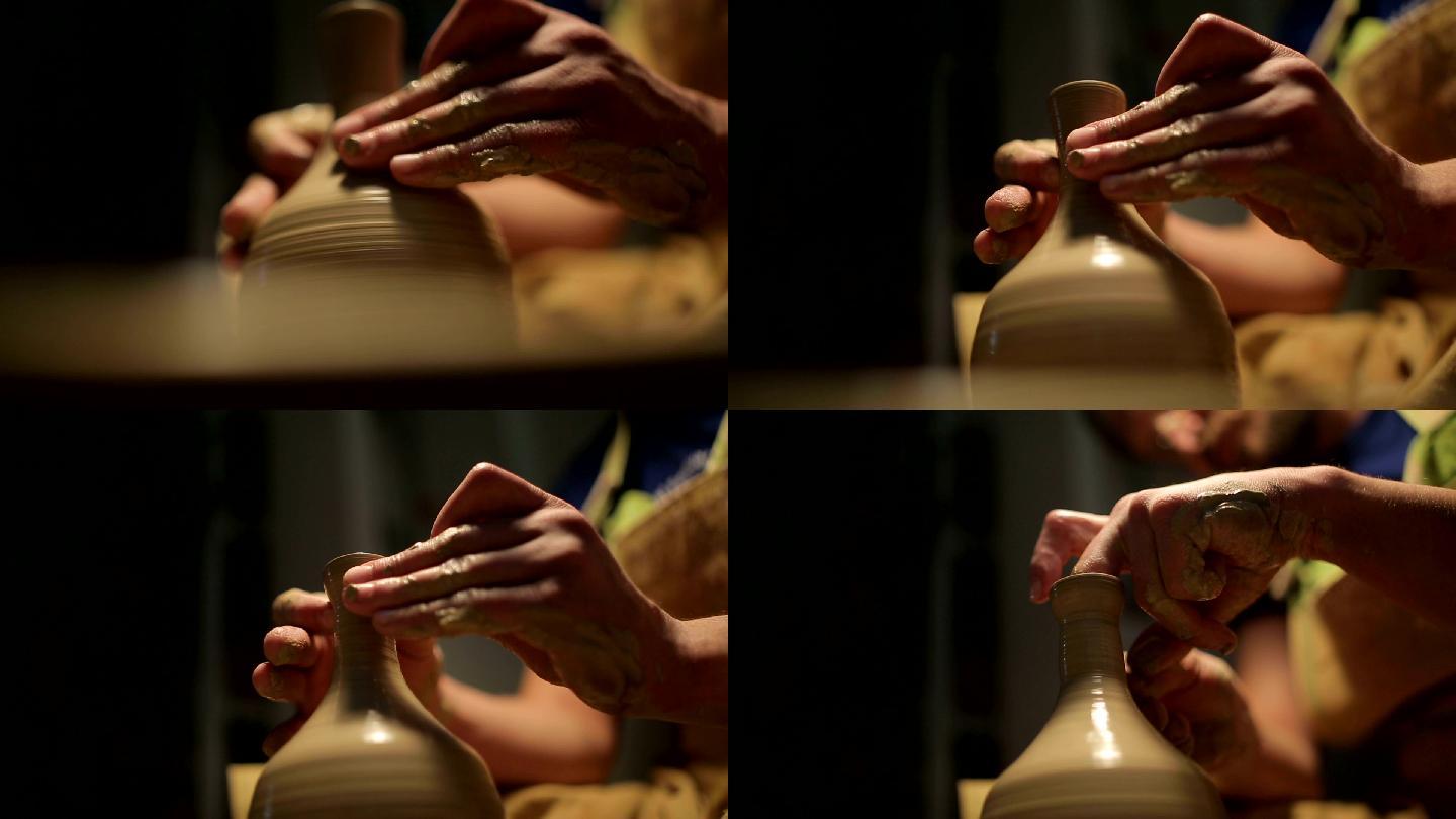 一个陶工的手，在圆圈上制作一个陶罐