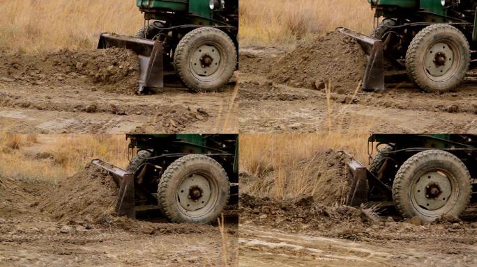 拖拉机运走泥土工程机械泥土整理土地平整