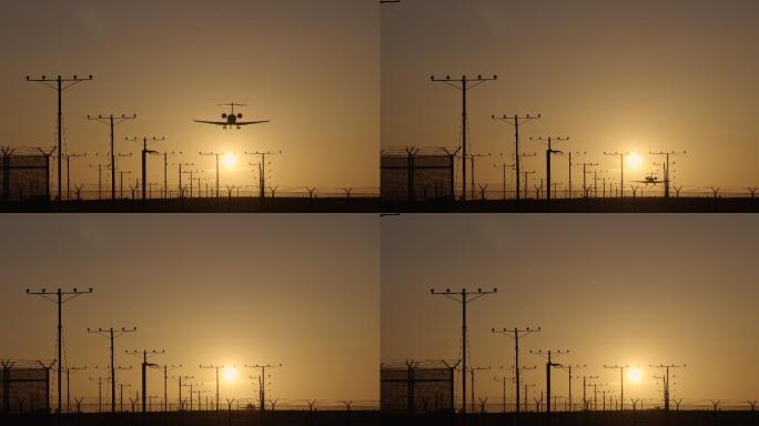 夕阳下从头顶飞过降落的飞机