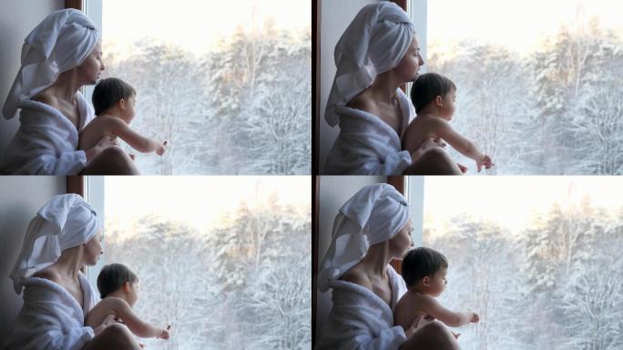 妈妈和儿子穿着浴衣坐在窗户上