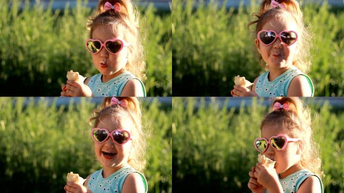 小女孩戴着太阳镜吃冰淇淋。
