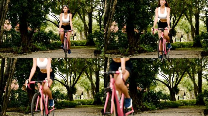 亚洲美女骑粉色自行车