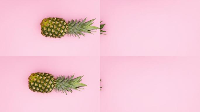 粉红色背景上的菠萝