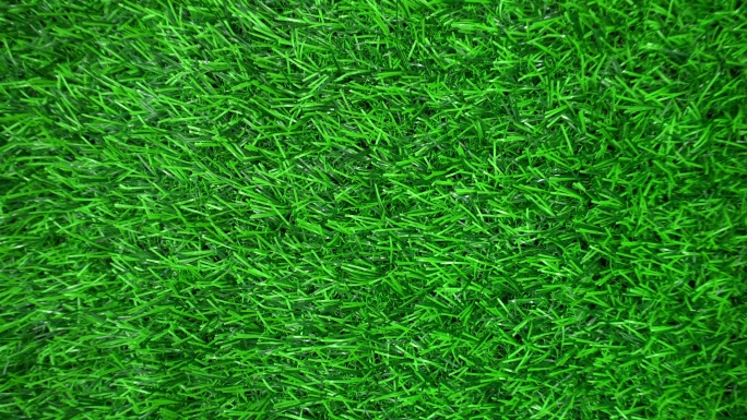 绿色人造草地旋转背景。