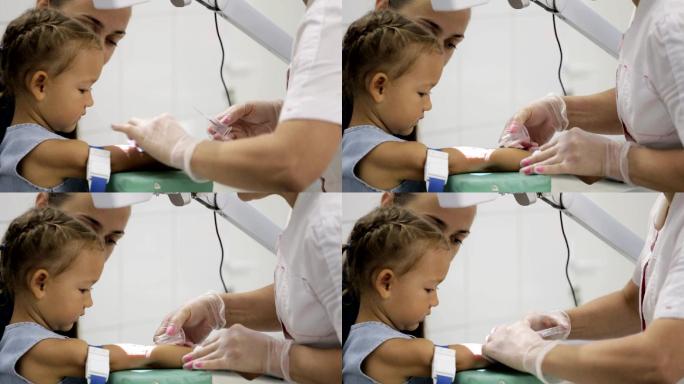 护士抽取女孩静脉血进行检测