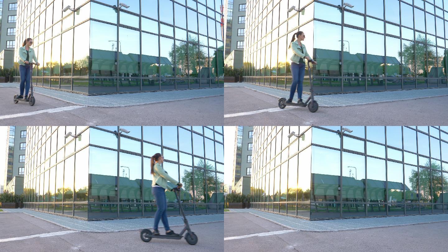 一名妇女骑着电动踏板车在城市中穿梭