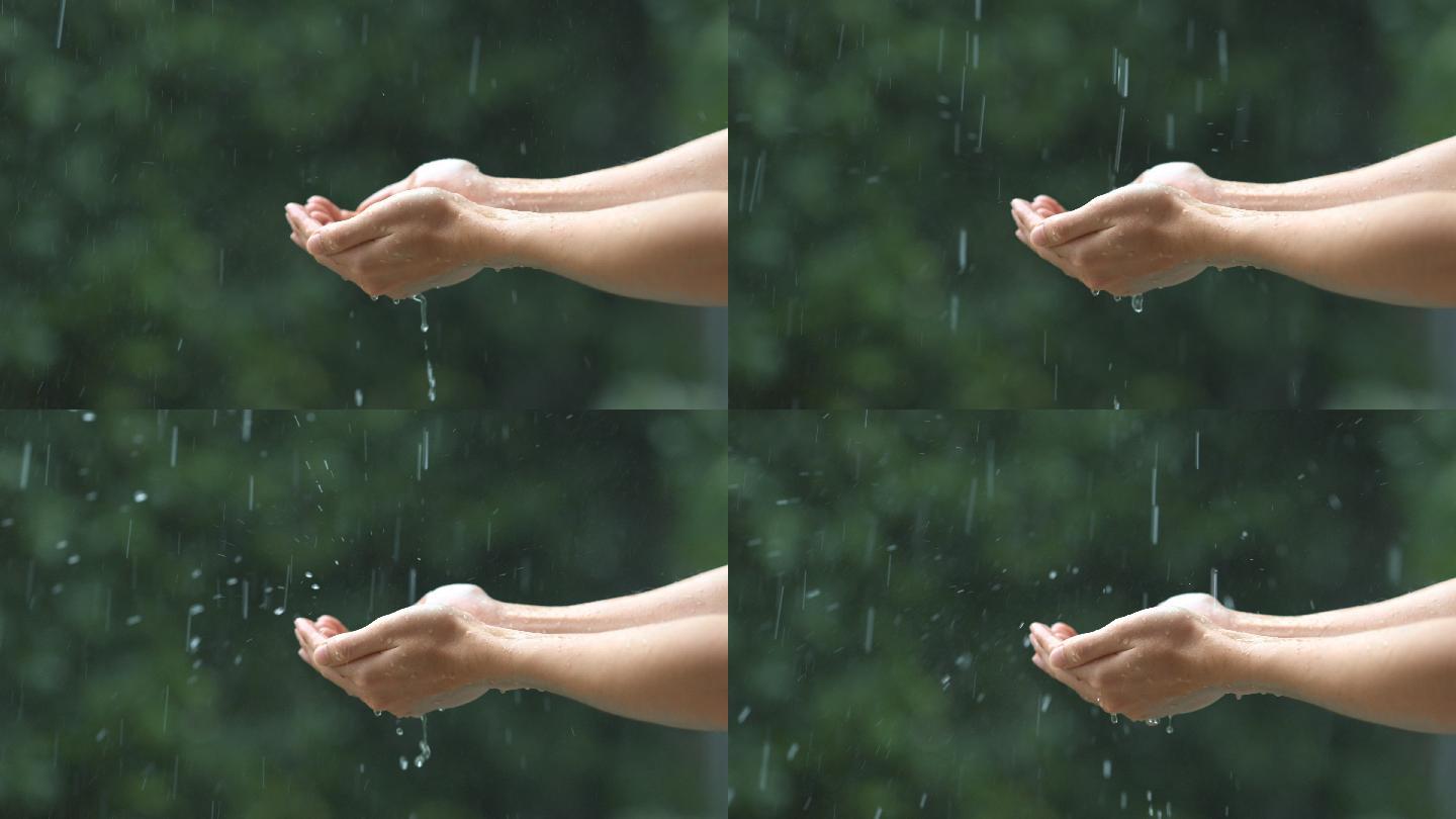 特写下女人的手上沾满了雨滴。