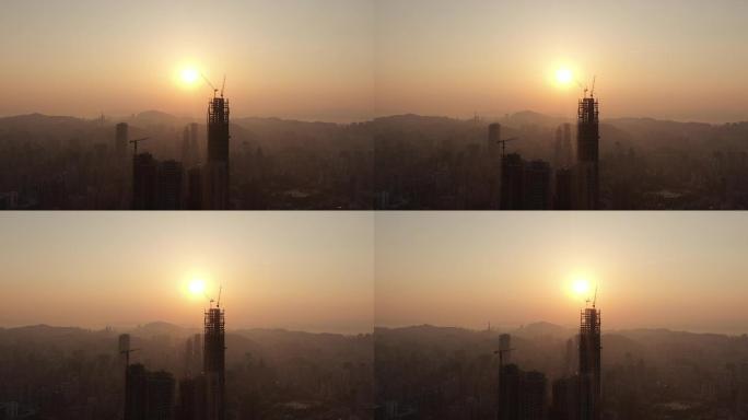 航拍城市清晨日落迷雾