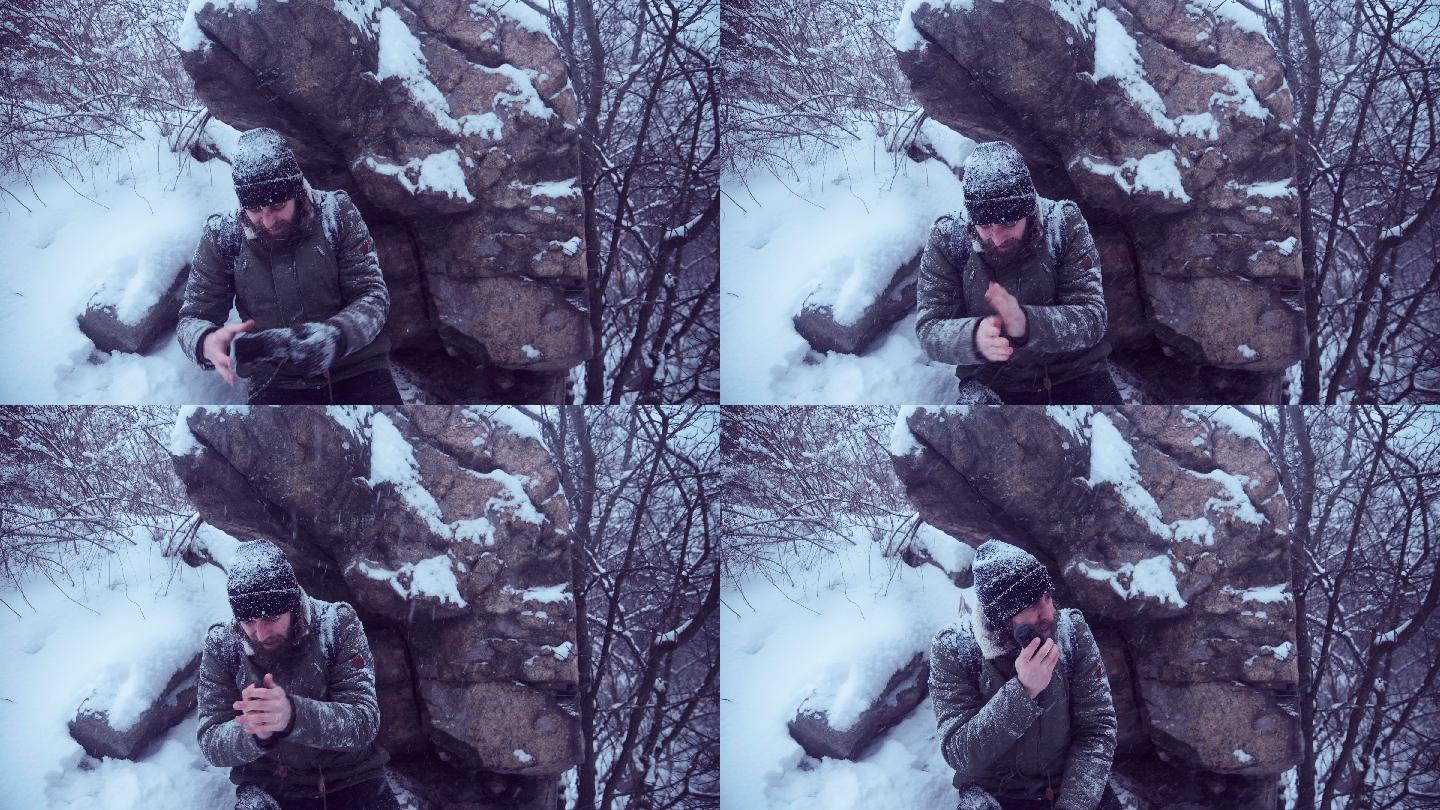 一个人试图在冬天的树林里攀爬岩石