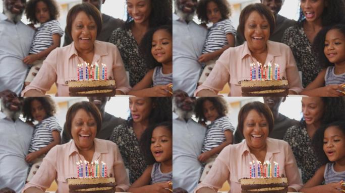 多代人家庭在家里用蛋糕庆祝祖母的生日