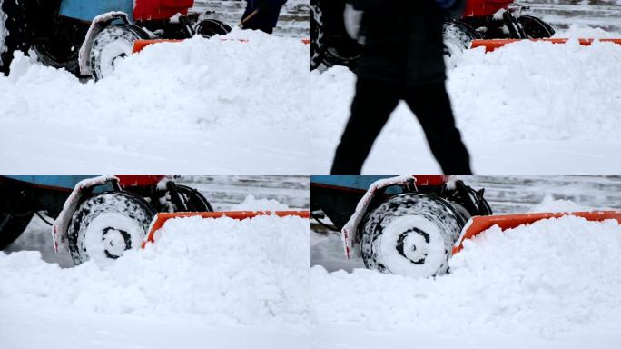 挖掘机清理城市街道上的大量积雪。