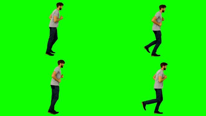 在绿色屏幕背景上跑步的休闲男子