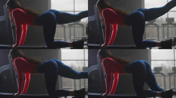 女子锻炼臀部和大腿后部的肌肉。