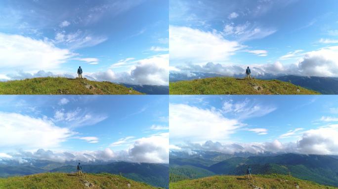 男子站在青山上看风景