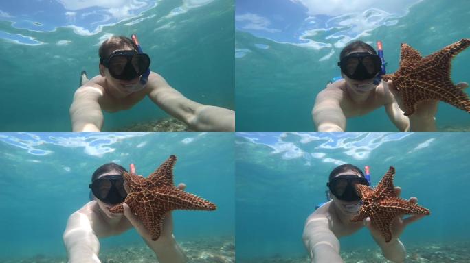 一名男子在水下浮潜时发现了海星
