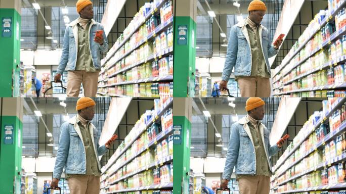 在购物的男人非洲商场超市购物扫码看手机