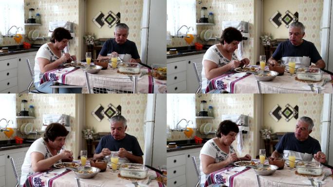 在厨房吃午餐老夫老妻用餐中老年