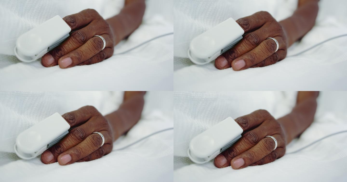 医院病房中男性患者手部脉搏血氧测定