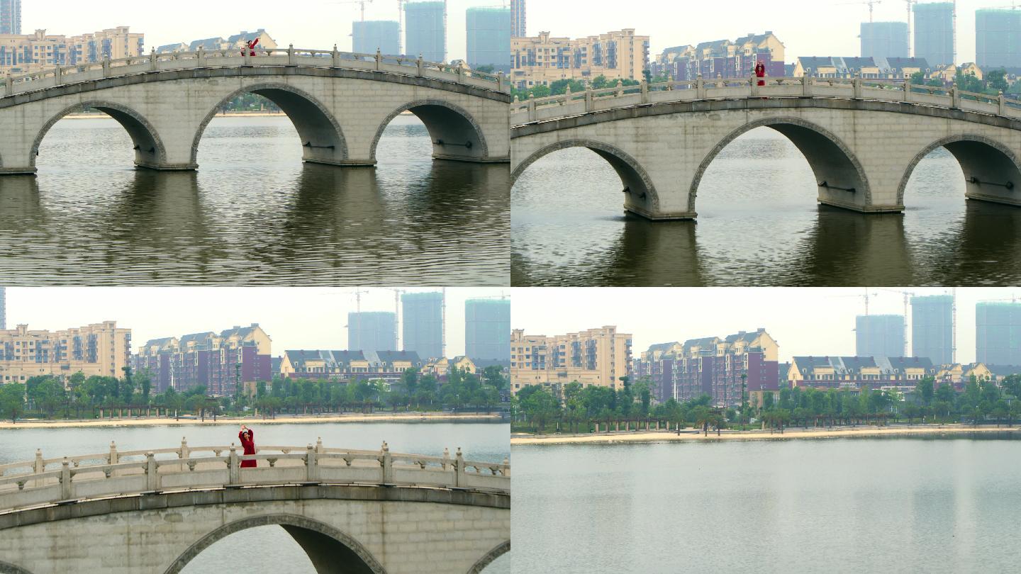 红衣女孩公园桥上跳舞4K航拍