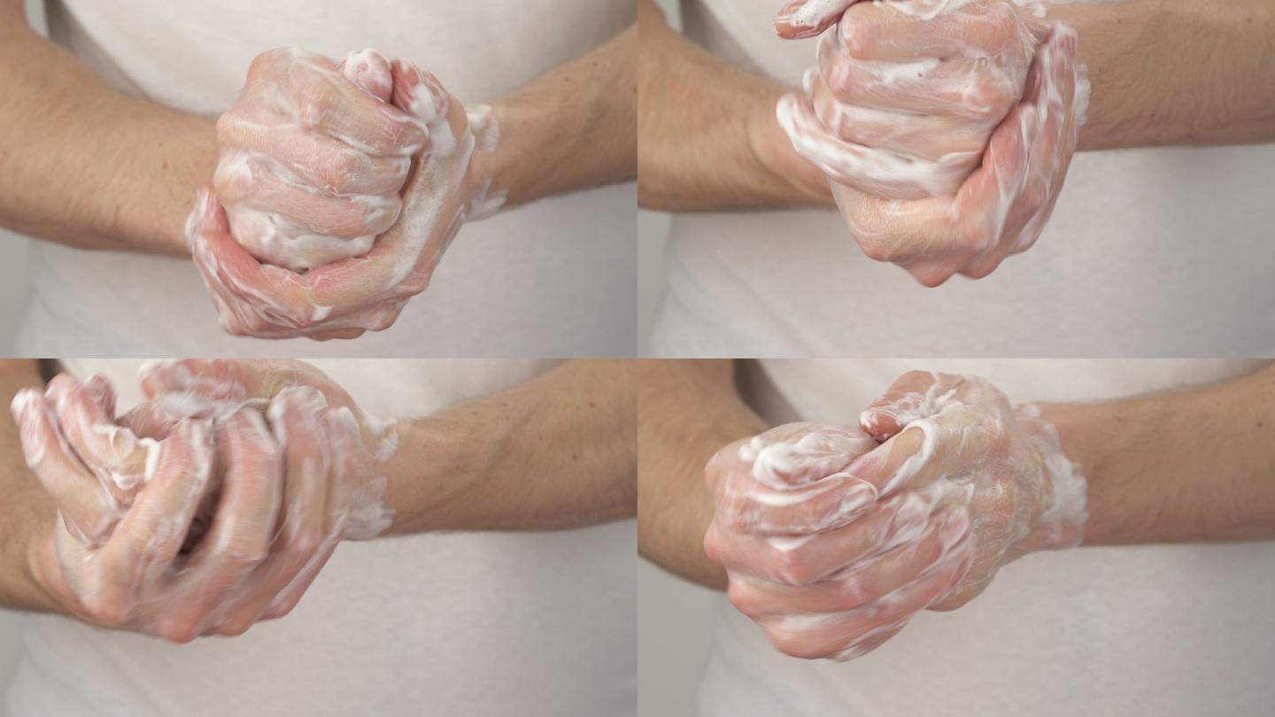 男子用肥皂擦手，双手起泡