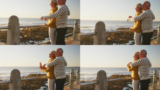 老年夫妇在海滩拥抱