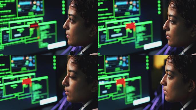 坐在电脑屏幕前的女青少年黑客