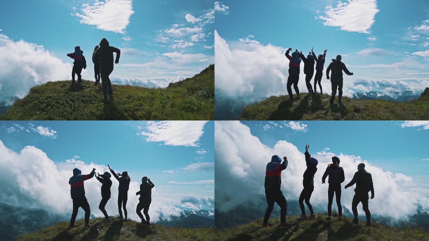 四个登上山顶的朋友